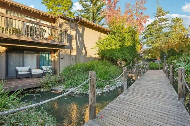 a view of a pathway with a wooden bridge