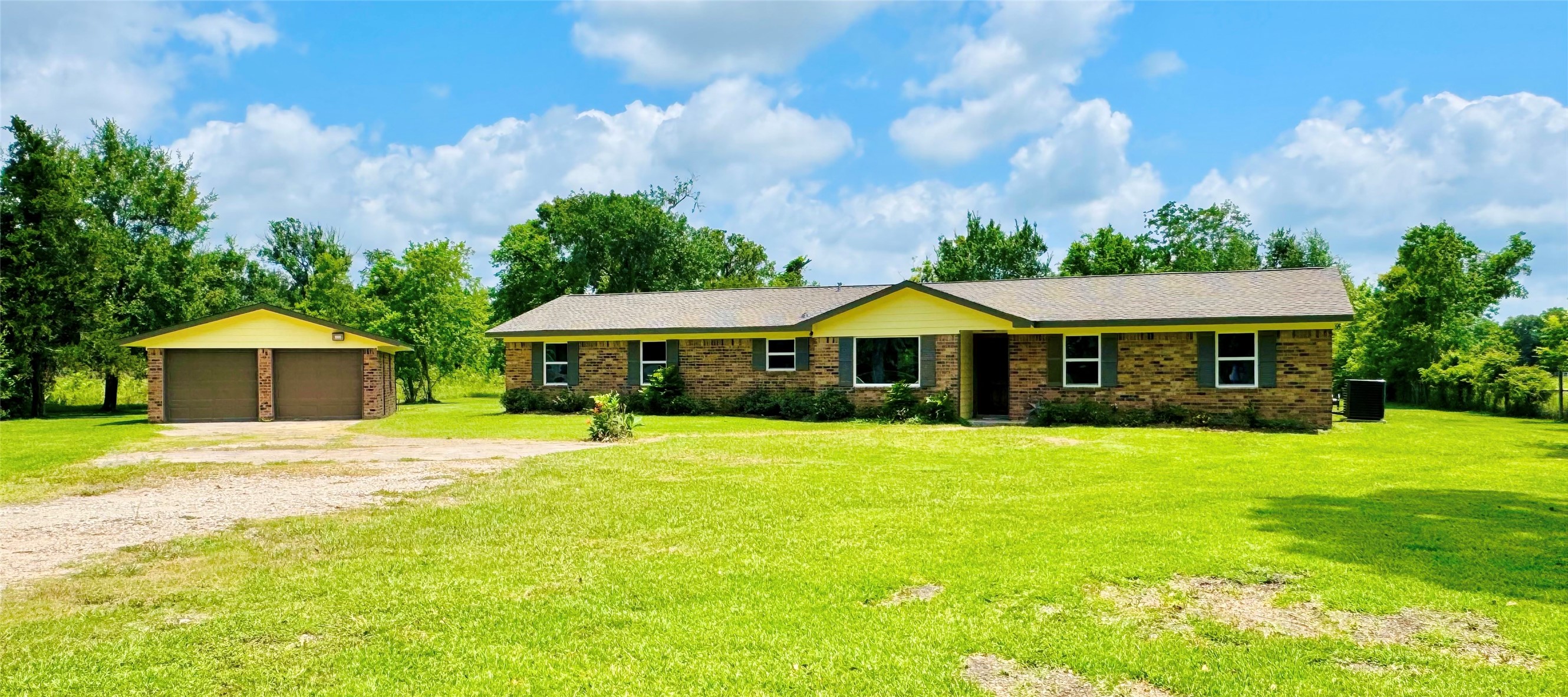 1434 County Road 878A Sweeny, TX 77480 - Photo 1 of 36 a front view of a house with garden