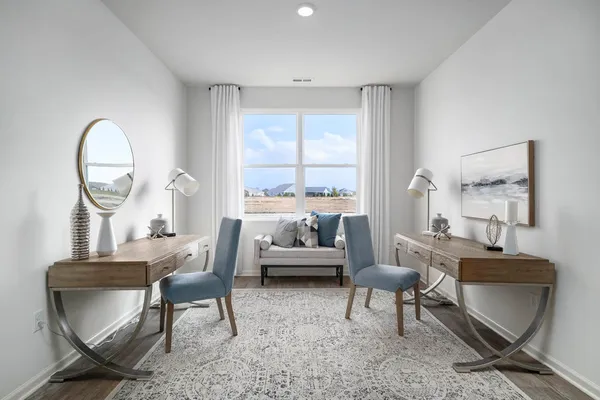 a kitchen with stainless steel appliances kitchen island granite countertop a refrigerator and a stove top oven