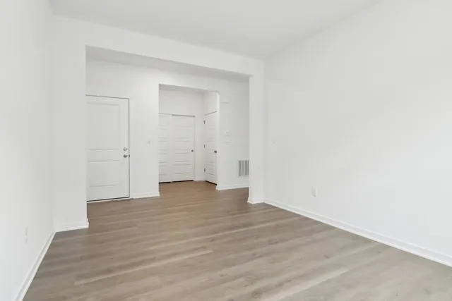 a kitchen with a sink a microwave and cabinets