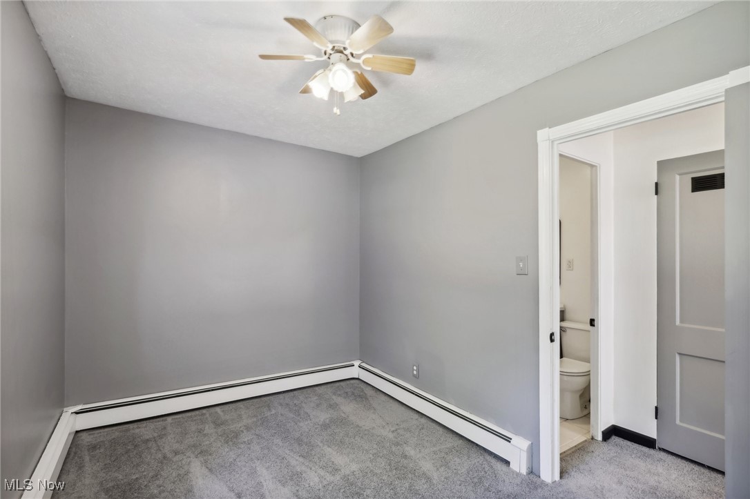 1829 Clyde Road Madison, OH 44057 - Photo 35 of 40 Carpeted spare room with ceiling fan