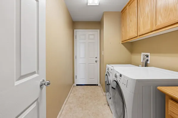 a utility room with a sink a washer and dryer