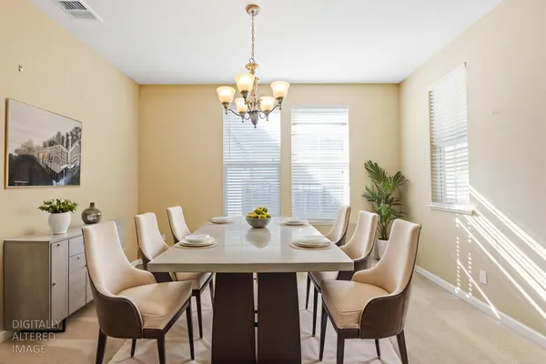 a view of a dining room with furniture window and outside view