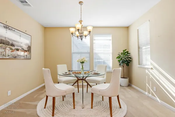 a view of a dining room with furniture window and outside view