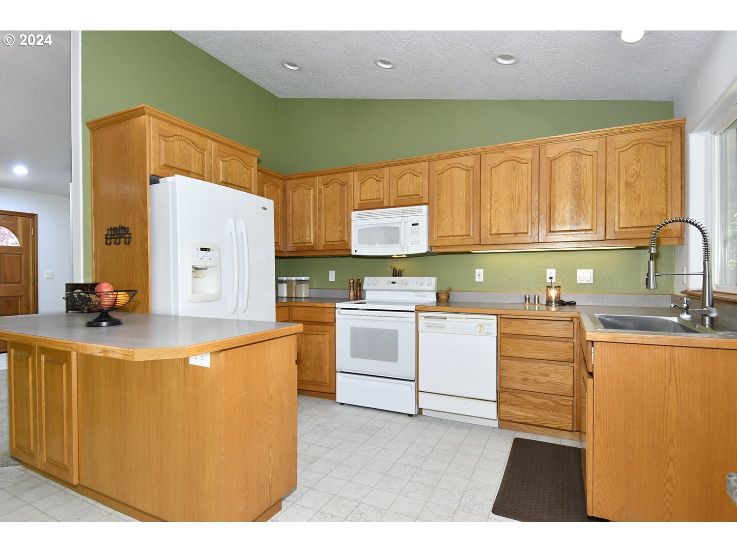 31955 Southeast Compton Road Boring, OR 97009 - Photo 11 of 48 a kitchen with cabinets and white appliances
