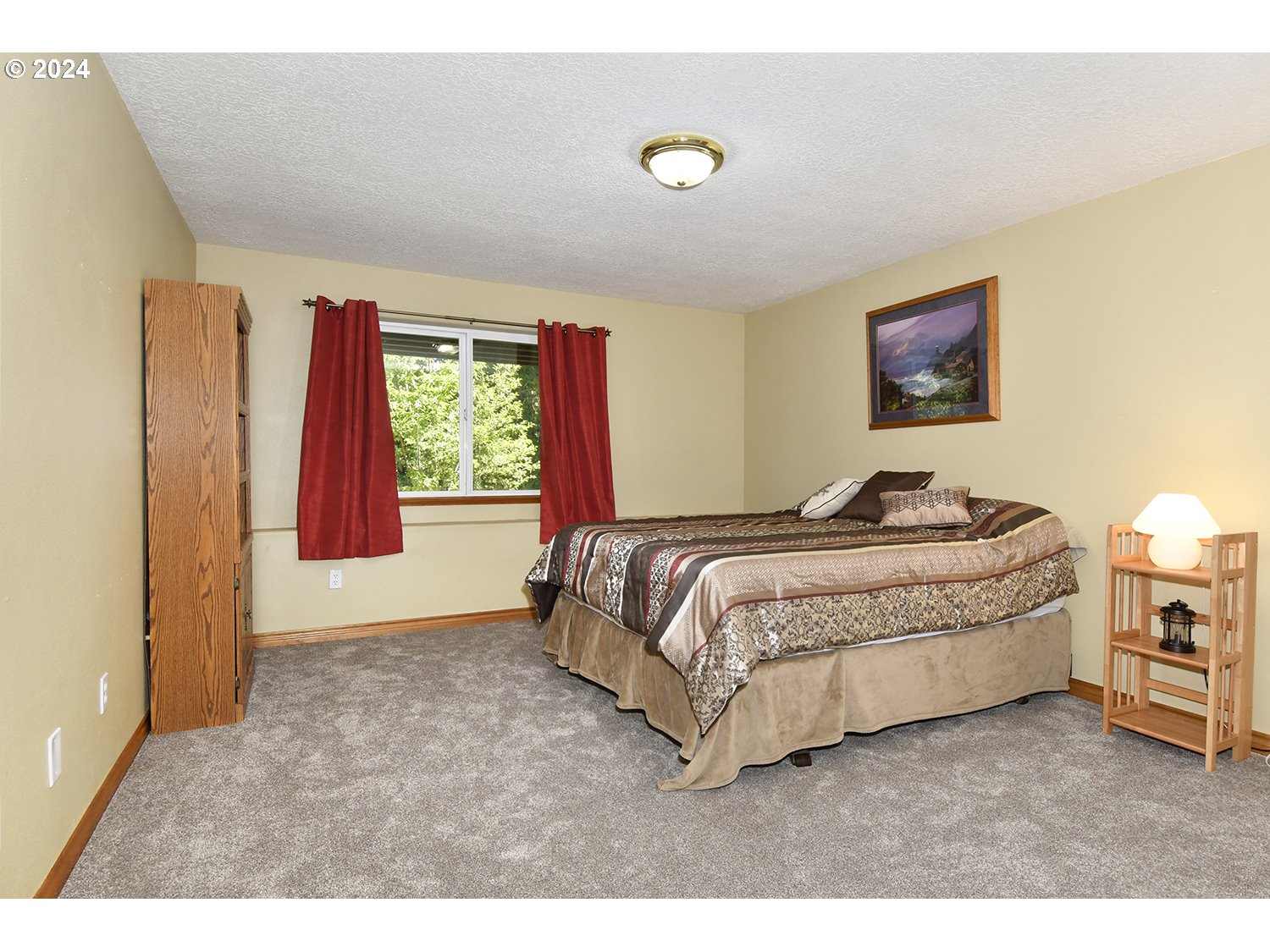 31955 Southeast Compton Road Boring, OR 97009 - Photo 16 of 48 a spacious bedroom with a bed and a night stand