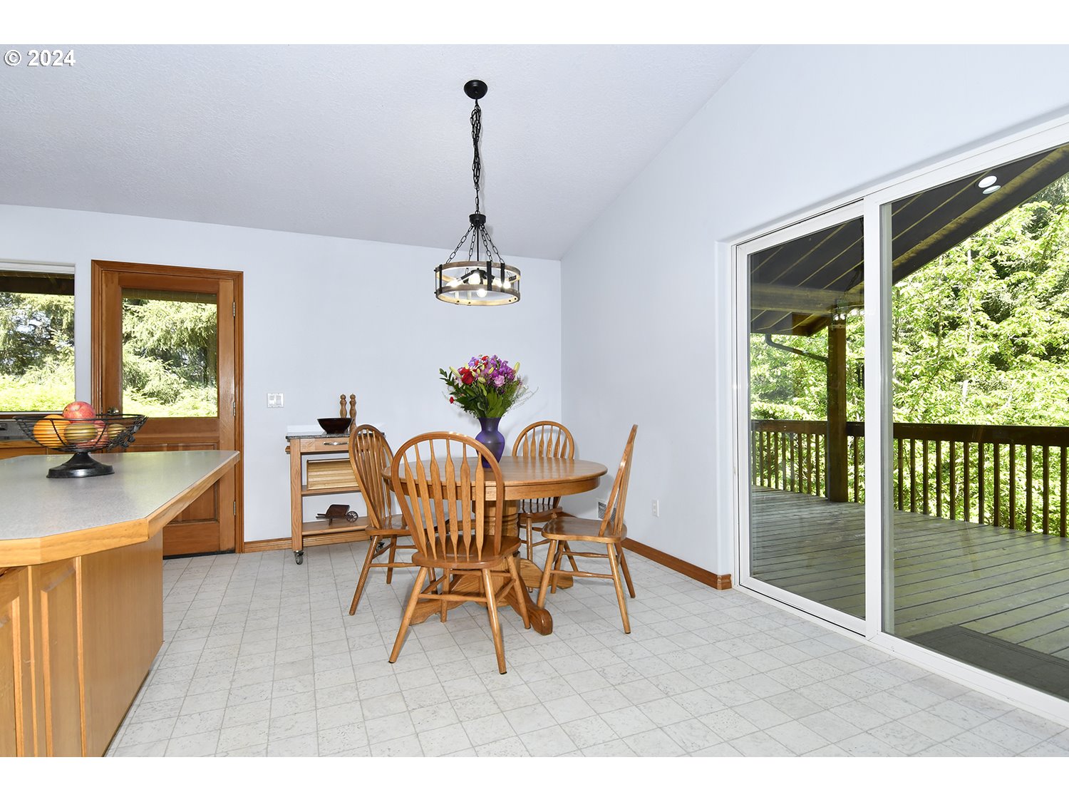 31955 Southeast Compton Road Boring, OR 97009 - Photo 9 of 48 a dining room with furniture a chandelier and wooden floor