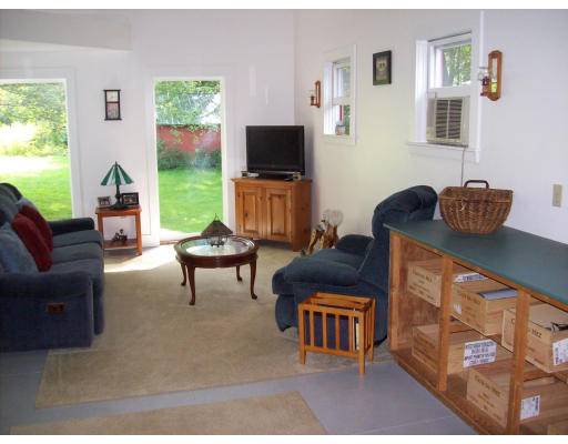 32 North Farms Road Williamsburg, MA 01039 - Photo 4 of 12 a living room with furniture and a flat screen tv