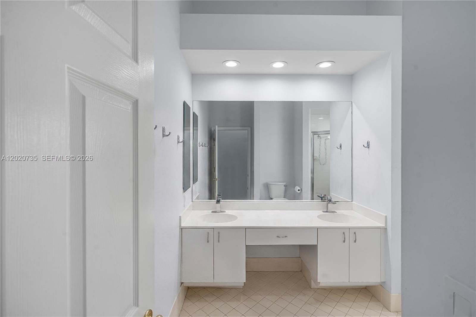 17244 Balboa Point Way Boca Raton, FL 33487 - Photo 58 of 66 a bathroom with a sink double vanity and a mirror