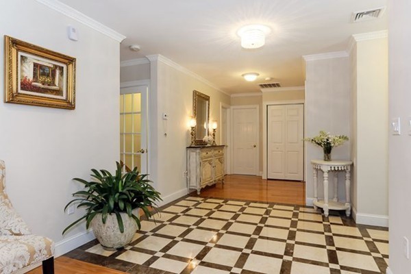 21 Chiltern Road Weston, MA 02493 - Photo 9 of 27 a view of a entryway door with a potted plant