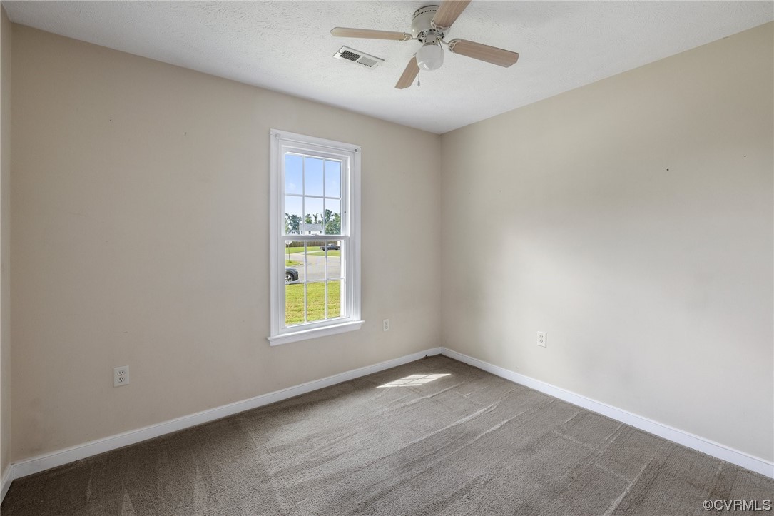 122 Pollard Place Aylett, VA 23009 - Photo 15 of 24 an empty room with a window and a fan