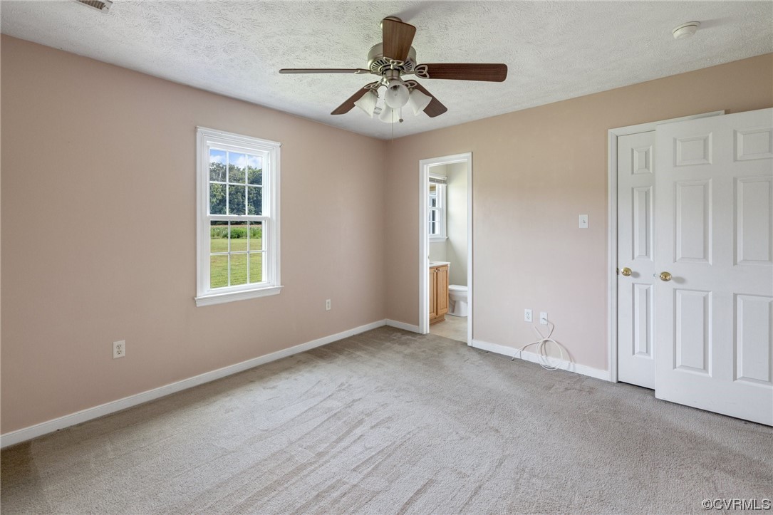 122 Pollard Place Aylett, VA 23009 - Photo 18 of 24 a view of a livingroom with a chandelier fan and windows