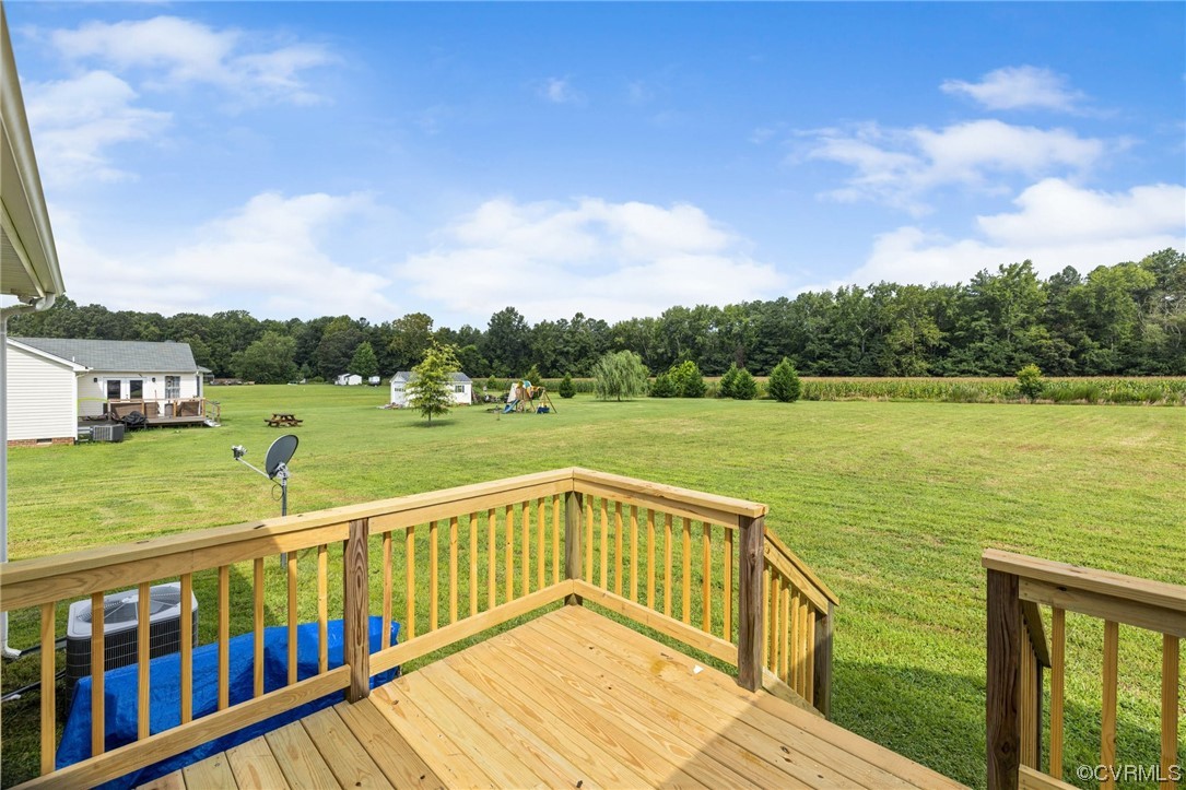 122 Pollard Place Aylett, VA 23009 - Photo 21 of 24 a view of a wooden deck and lake