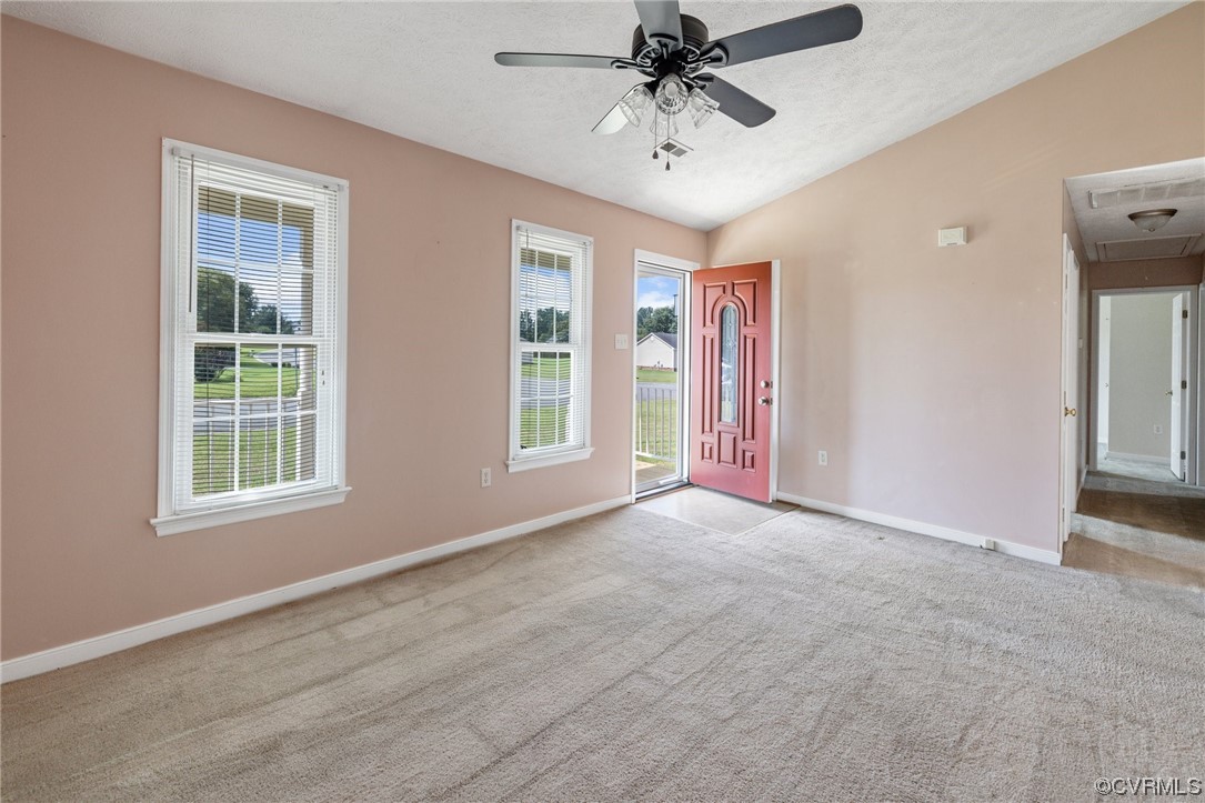 122 Pollard Place Aylett, VA 23009 - Photo 7 of 24 an empty room with chandelier fan and windows