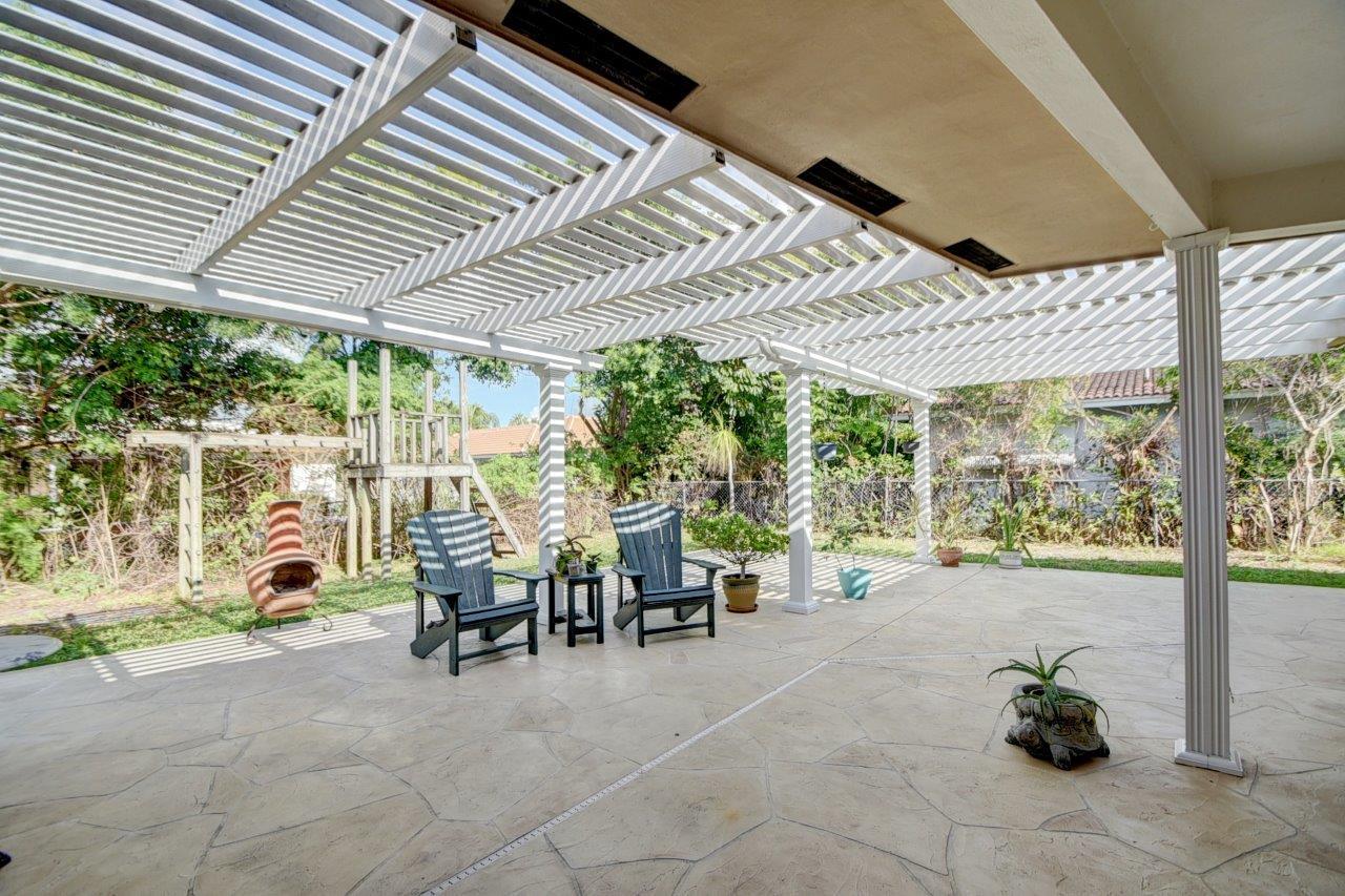 611 Northwest 16th Avenue Boca Raton, FL 33486 - Photo 31 of 45 Spacious patio with pergola