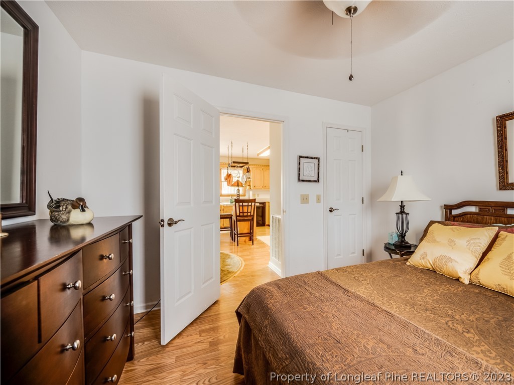 2947 Smith Mill Road Lumberton, NC 28358 - Photo 23 of 50 a bedroom with a bed and wooden floor