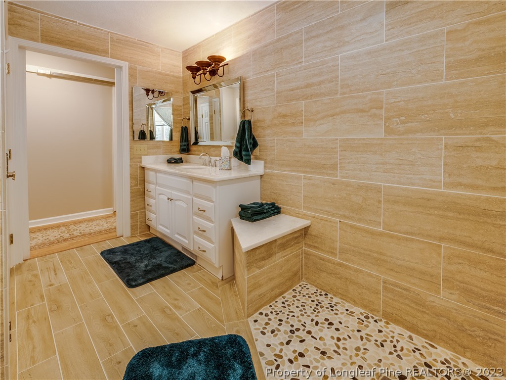 2947 Smith Mill Road Lumberton, NC 28358 - Photo 26 of 50 a bathroom with a sink and a mirror