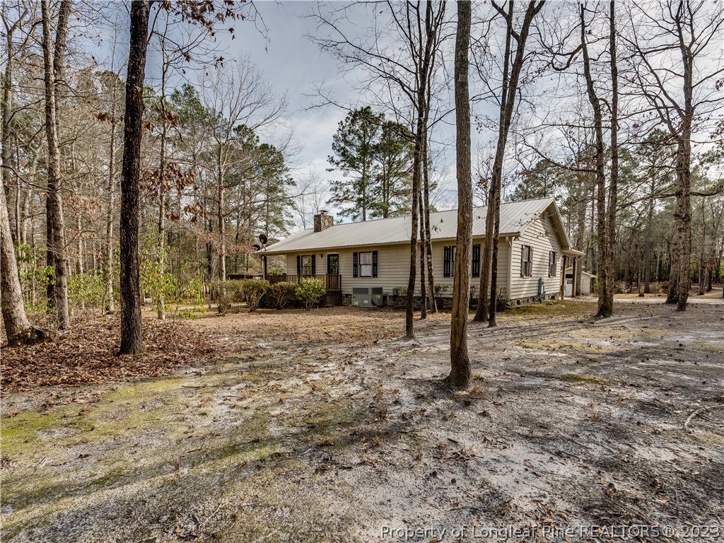 2947 Smith Mill Road Lumberton, NC 28358 - Photo 3 of 50 a view of a house with a yard and tree s