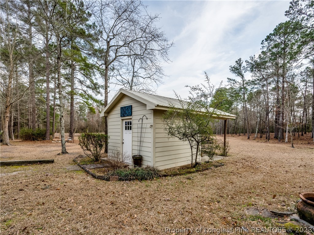 2947 Smith Mill Road Lumberton, NC 28358 - Photo 34 of 50 a view of a house with a yard