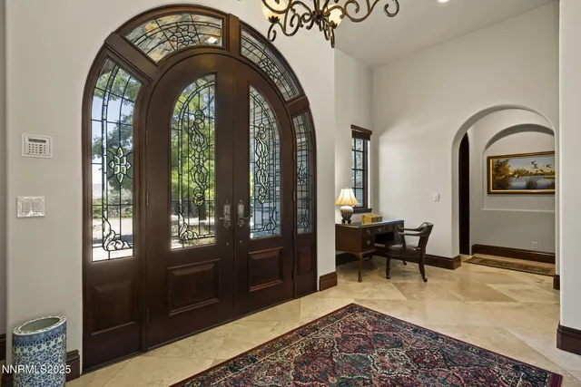 a kitchen with granite countertop a sink and cabinets