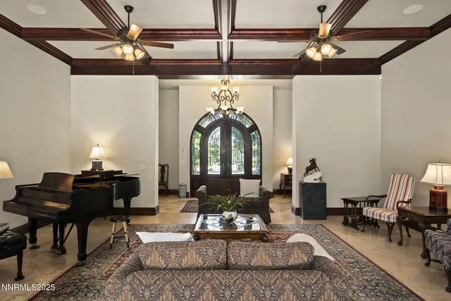 a living room with furniture a fireplace and a table