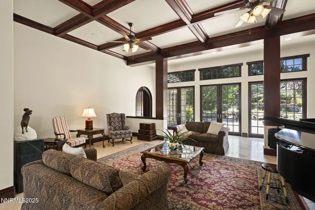 a living room with furniture rug and wooden floor