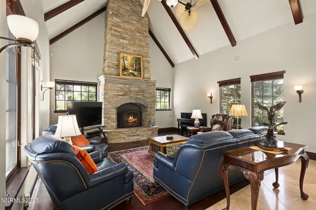 a kitchen with stainless steel appliances granite countertop a refrigerator and a stove