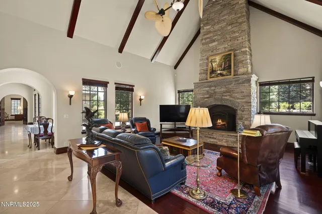 a bathroom with a granite countertop sink toilet and a mirror