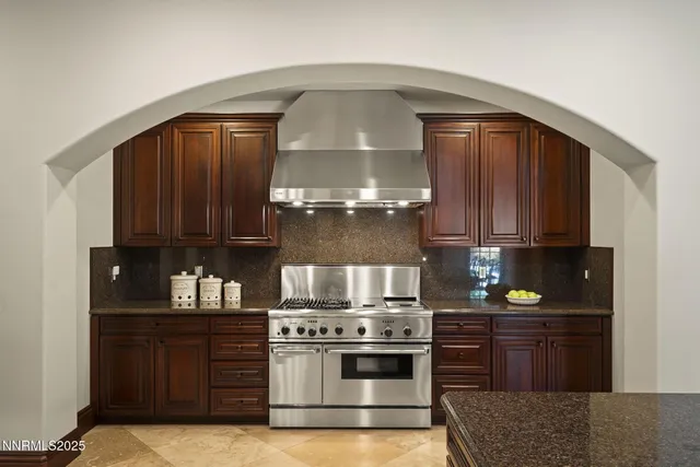 a living room with furniture a chandelier and a flat screen tv
