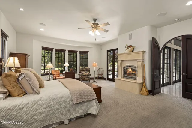 a bathroom with a granite countertop sink a toilet and shower