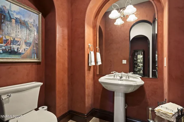 a living room with lots of furniture and a chandelier