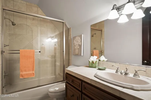 a view of a patio with table and chairs and potted plants