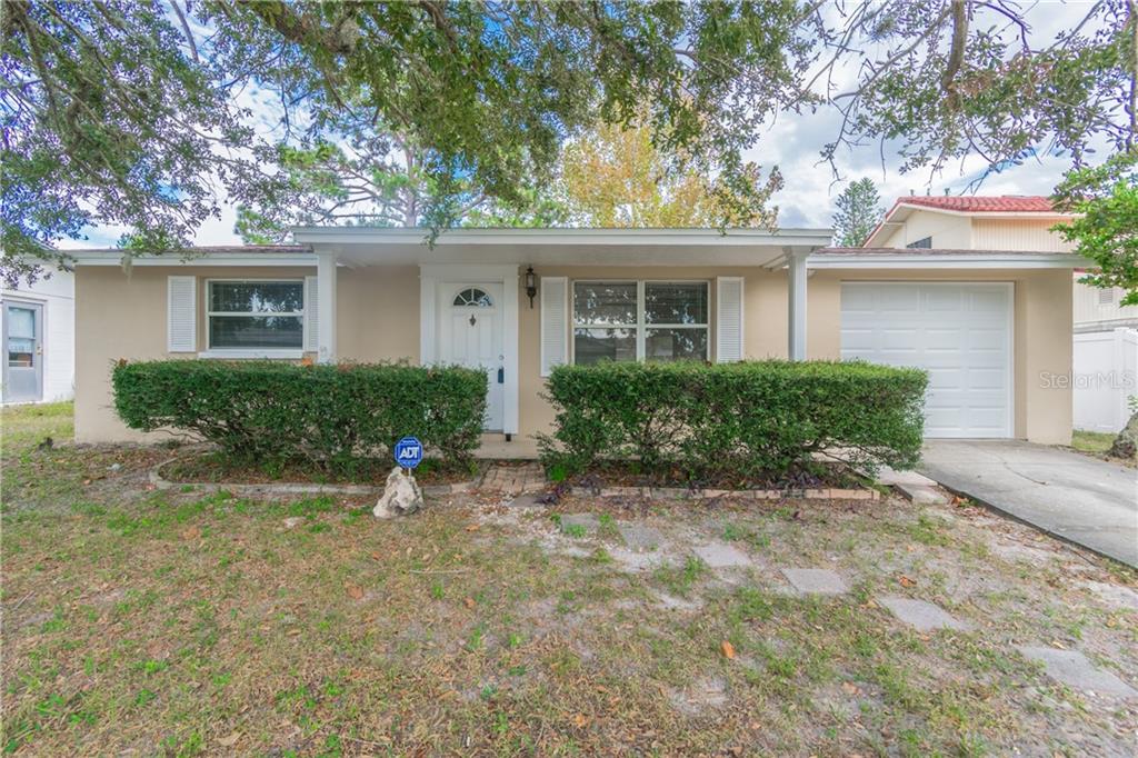 9106 Suffolk Lane Port Richey, FL 34668 - Photo 1 of 1 Front of Home- NEW Roof, NEW Garage Door and Remote Opener.