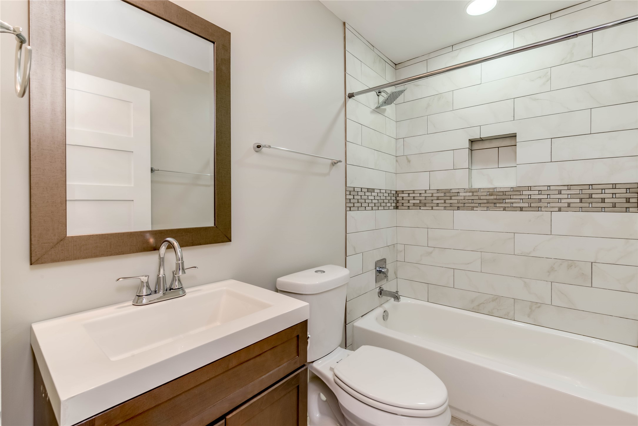 4702 Bandera Road Austin, TX 78721 - Photo 9 of 12 a bathroom with a sink toilet and shower