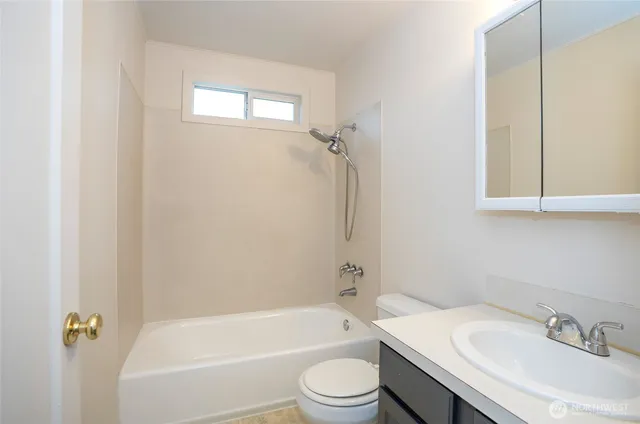 a bathroom with a sink a toilet and a bathtub