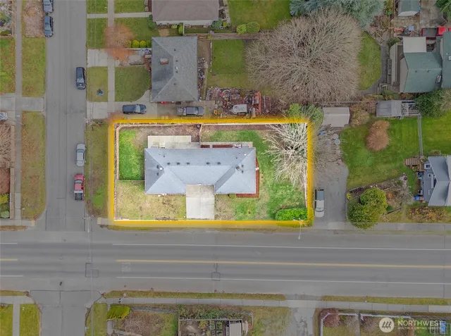 an aerial view of a house with a swimming pool