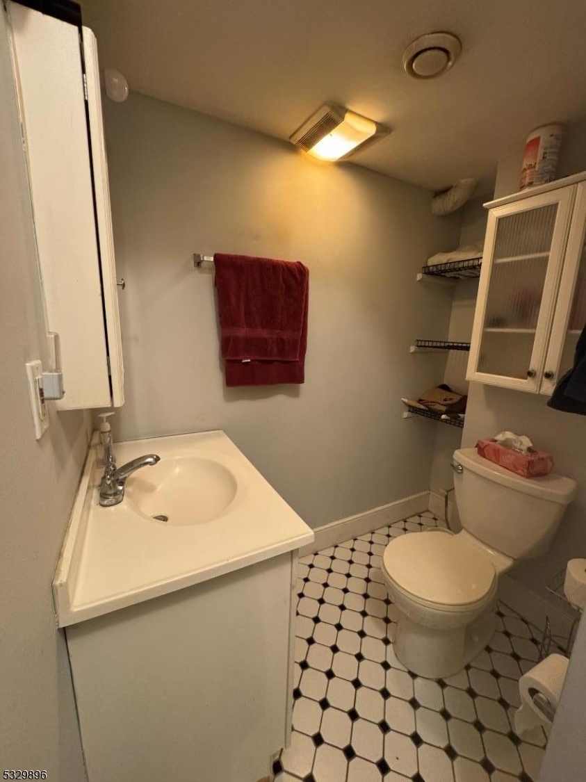 107 Mechanic Street, Unit 9 Boonton, NJ 07005 - Photo 11 of 12 a bathroom with a sink and a mirror