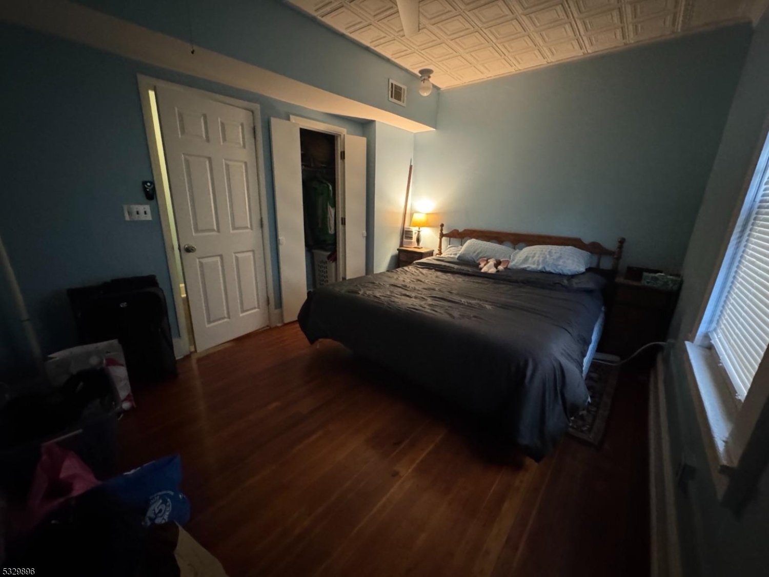 107 Mechanic Street, Unit 9 Boonton, NJ 07005 - Photo 5 of 12 a bedroom with a bed and wooden floor