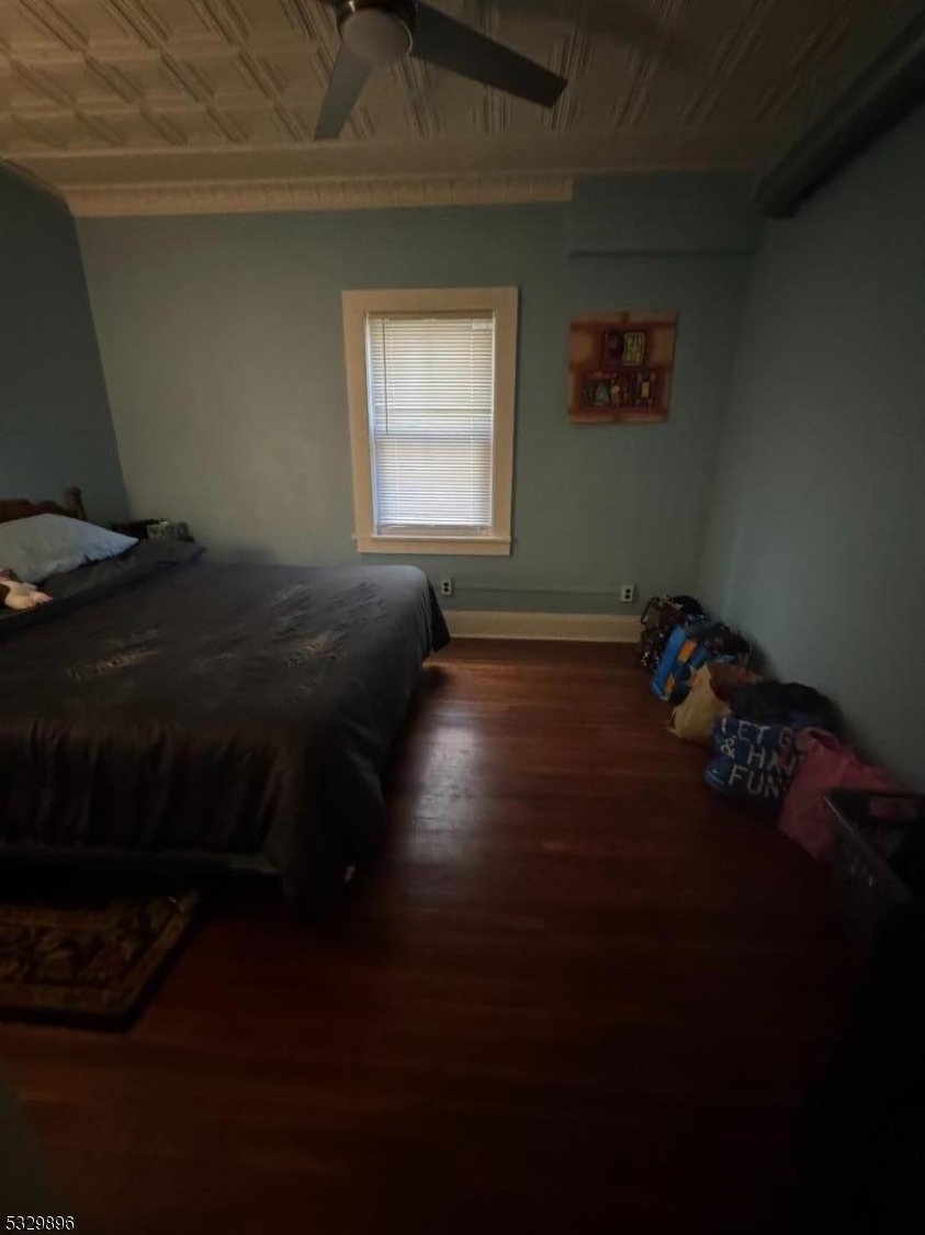 107 Mechanic Street, Unit 9 Boonton, NJ 07005 - Photo 6 of 12 a bed sitting in a bedroom next to a window
