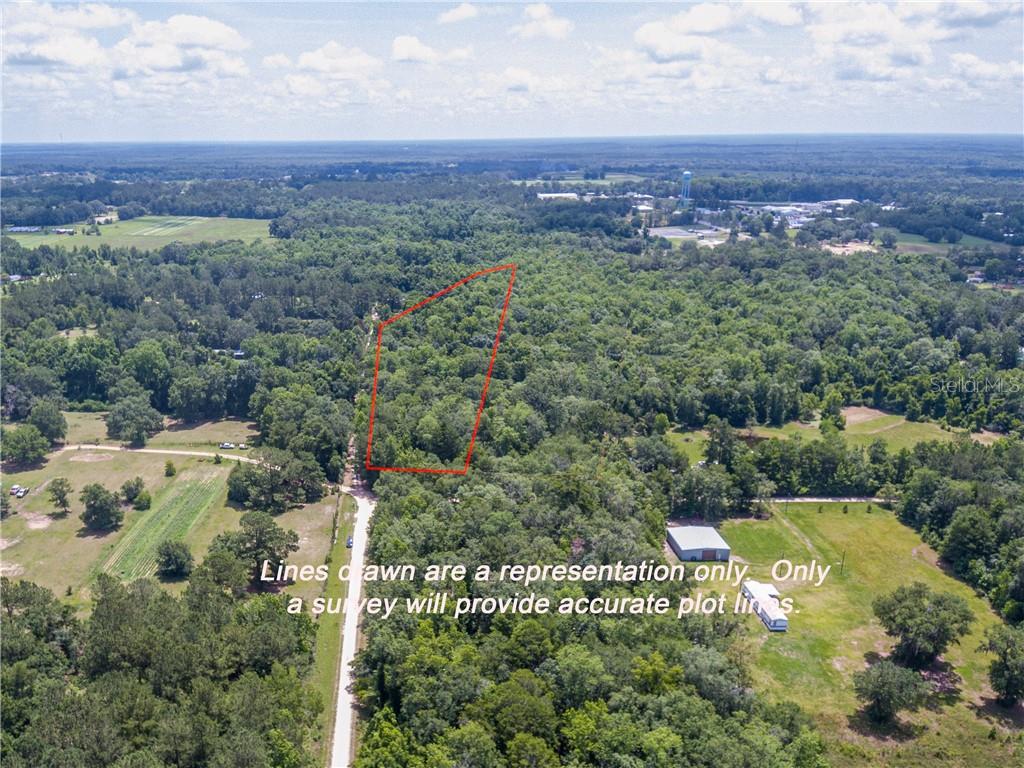Vista Road Monticello, FL 32344 - Photo 1 of 1 an aerial view of a houses with a yard and lake