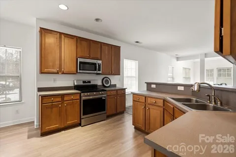 a view of a dining room with furniture and a large window