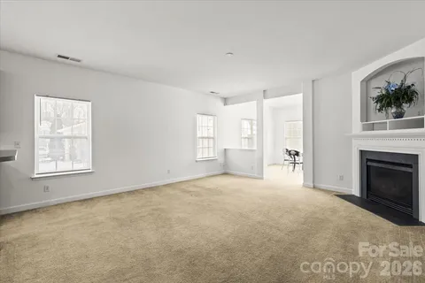a dining room with furniture and windows
