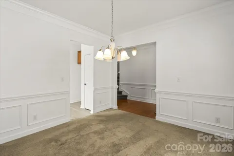 a kitchen with stainless steel appliances granite countertop a sink a stove and a wooden floors