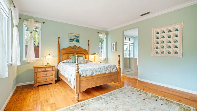 a bedroom with a bed and a dresser in it