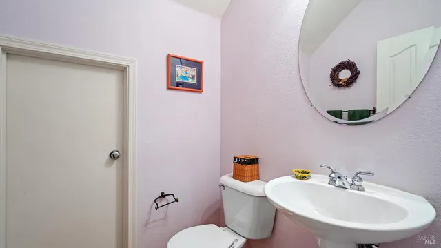 a view of a livingroom with furniture and windows