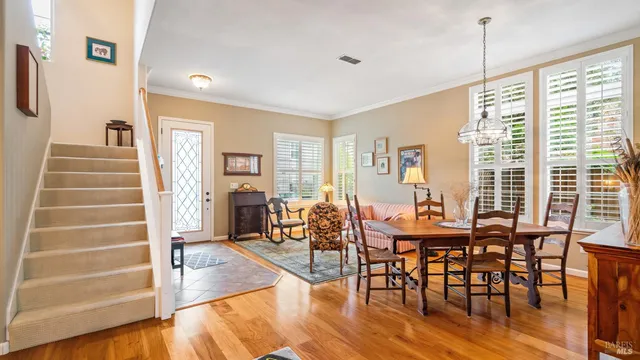 a view of a livingroom with furniture window and wooden floor