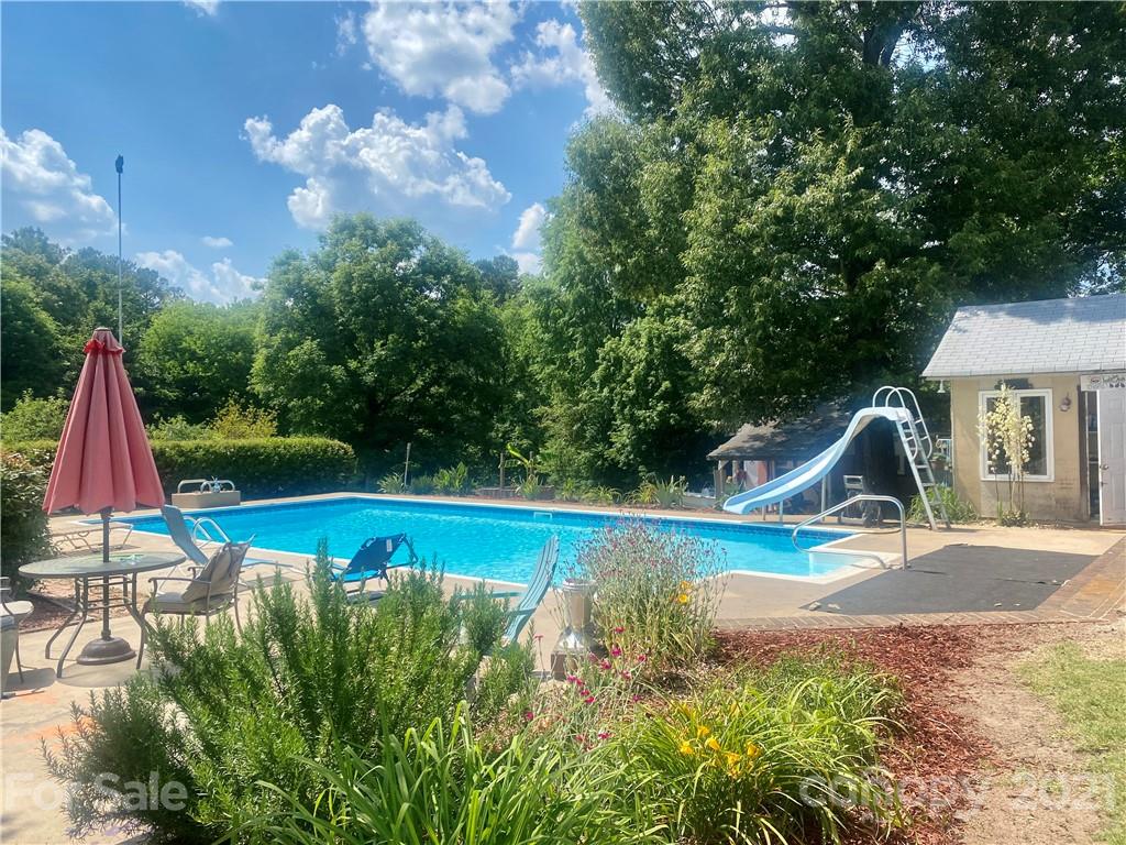 2490 Pinckney Road Chester, SC 29706 - Photo 1 of 47 a view of backyard with swimming pool and slide