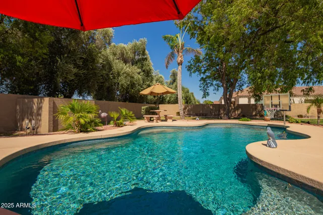 a view of a garden with a house