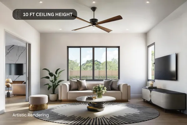 a living room with furniture potted plant and a flat screen tv