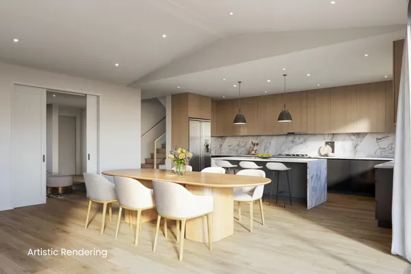 a large kitchen with a table and chairs in it